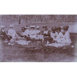 Group of ten women and one child on a picnic