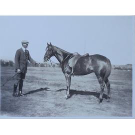 Man standing with horse