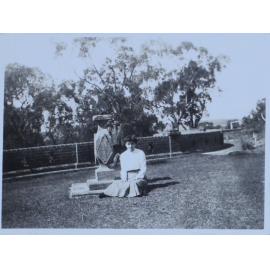 Woman sitting in front of a sundial