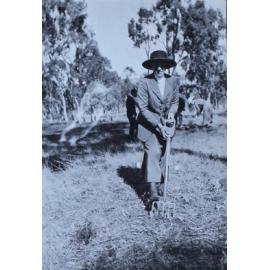 Woman with a digging fork, other in the background