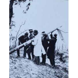 Group of men with the Metz sign, east of Armidale, NSW