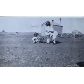 Three children with a pet dog