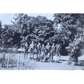Group of twelve man in the gardens