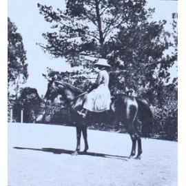 Woman on horseback in the gardens
