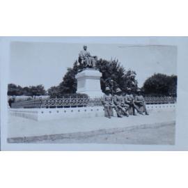 Soldiers in front of a statue