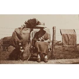 Unidentified woman with a cat and a dog