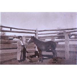 Unidentified woman with a foal