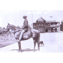 Unidentified mounted rider and dog