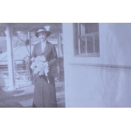 Unidentified woman holding flowers