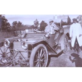Unidentified couple in a car with another man