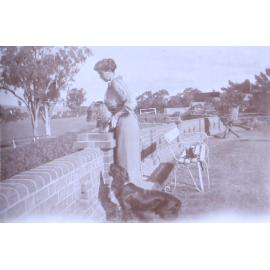 Unidentified woman with pet dogs