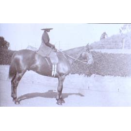 Unidentified woman on horseback