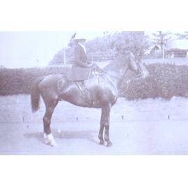 Unidentified woman on horseback