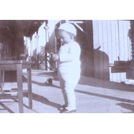 Unidentified child on verandah