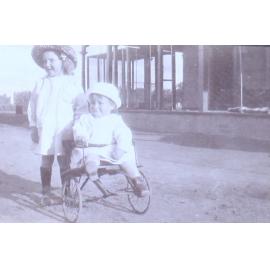 Unidentified children outside a house