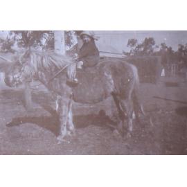 Unidentified child on a pony