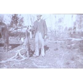 Unidentified man with a dead fox