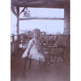 Unidentified girl on verandah