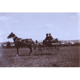 Two unidentified men in a buggy