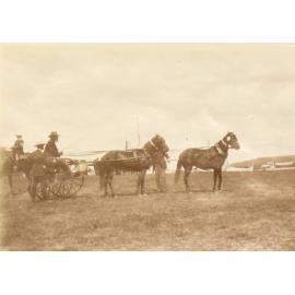 Unidentified men with horses and buggy