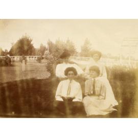Four unidentified women in a garden