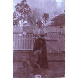Unidentified woman with pet dog