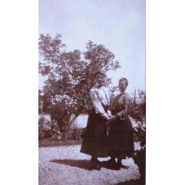 Two unidentified women in the garden