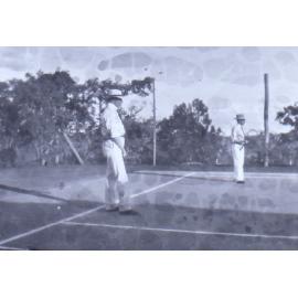 Two unidentified men on a tennis court