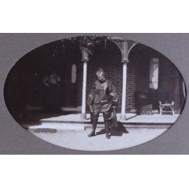 Unidentified woman in plastic [?] clothes