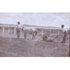 Two workmen with horse drawn lawnmower[?]