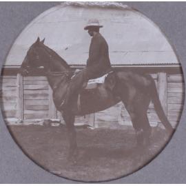 Unidentified man on a horse