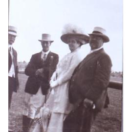Unidentified group of three men and one woman