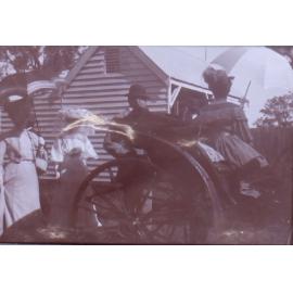 Unidentified group near a buggy