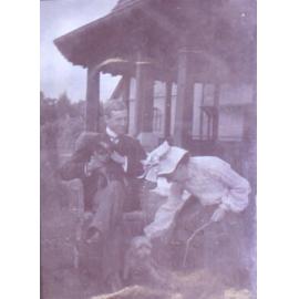 Unidentified couple with pet dogs