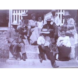 Unidentified group sitting on steps