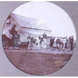 Unidentified men with a wagon