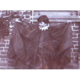 Unidentified child in a large robe