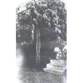 Garden with child and toys on the steps