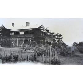 Tennis court, house and gardens at Saumarez