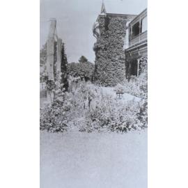 View of gardens with the homestead in the background