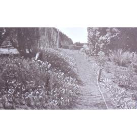 View of the gardens around the tennis court at Saumarez