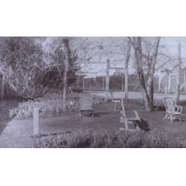 View of the gardens around the tennis court at Saumarez