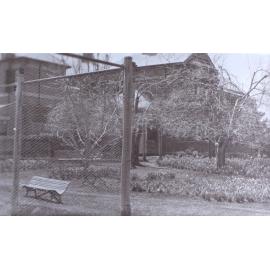 View of the gardens around the tennis court at Saumarez