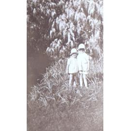 Two unidentified children in the garden