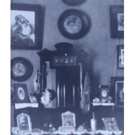 Interior photo showing pictures on wall and furniture
