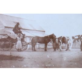 Unidentified man on a wagon harnassed to four horses