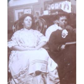 Two unidentified women sitting in the house