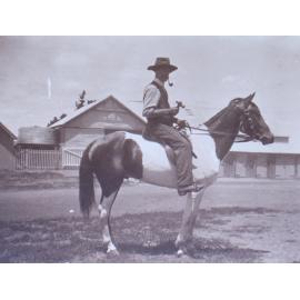 Unidentified man on a horse