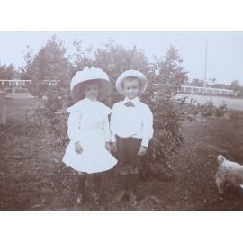 Two unidentified children in the garden