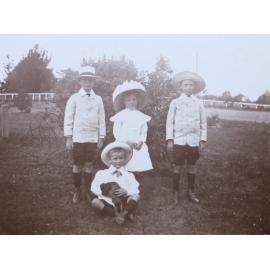 Four unidentified children in the garden
